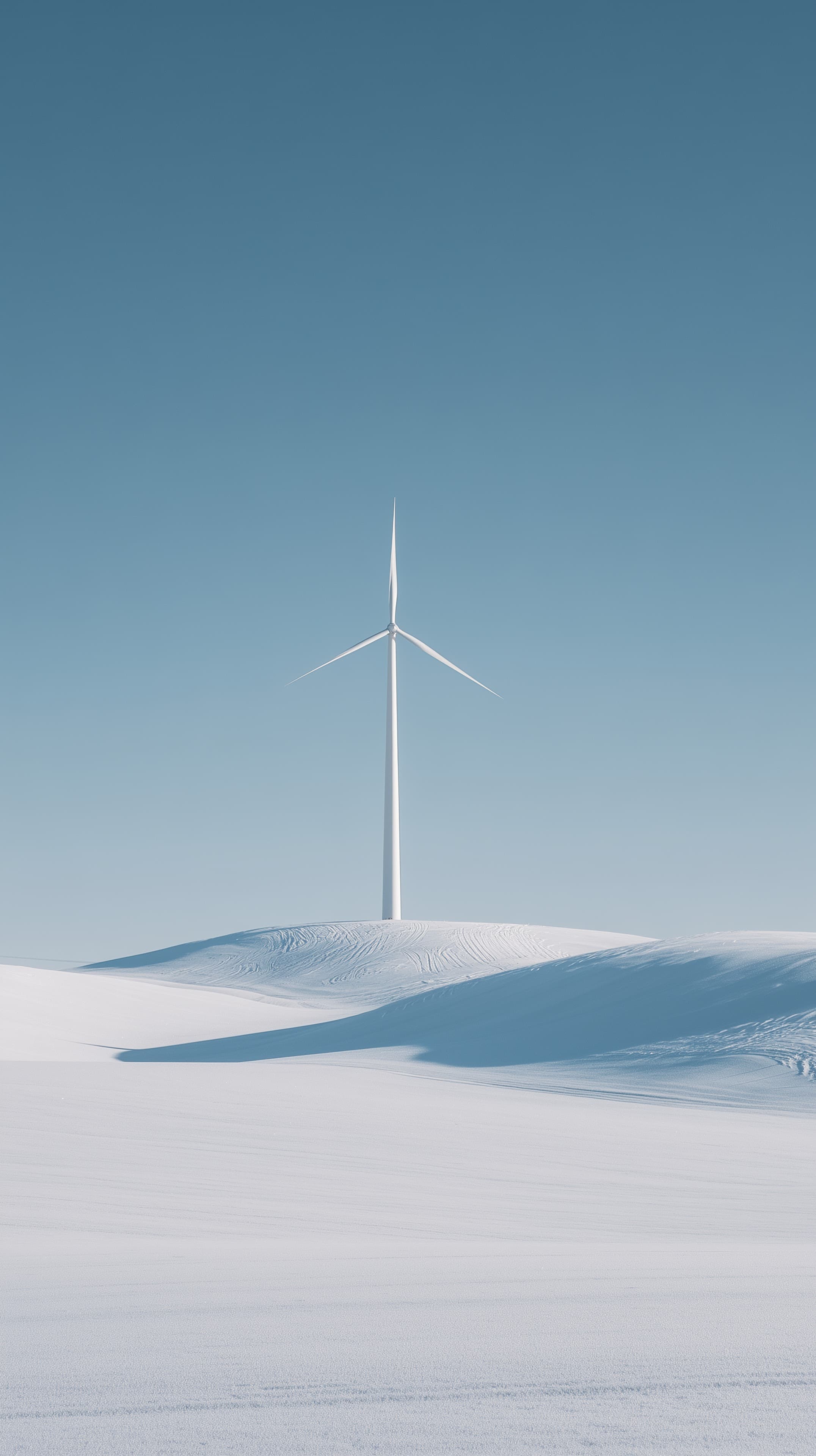 Serene Snowy Landscape with Wind Turbine under Clear Sky - High Resolution blue-sky Wallpaper for Mobile and Desktop