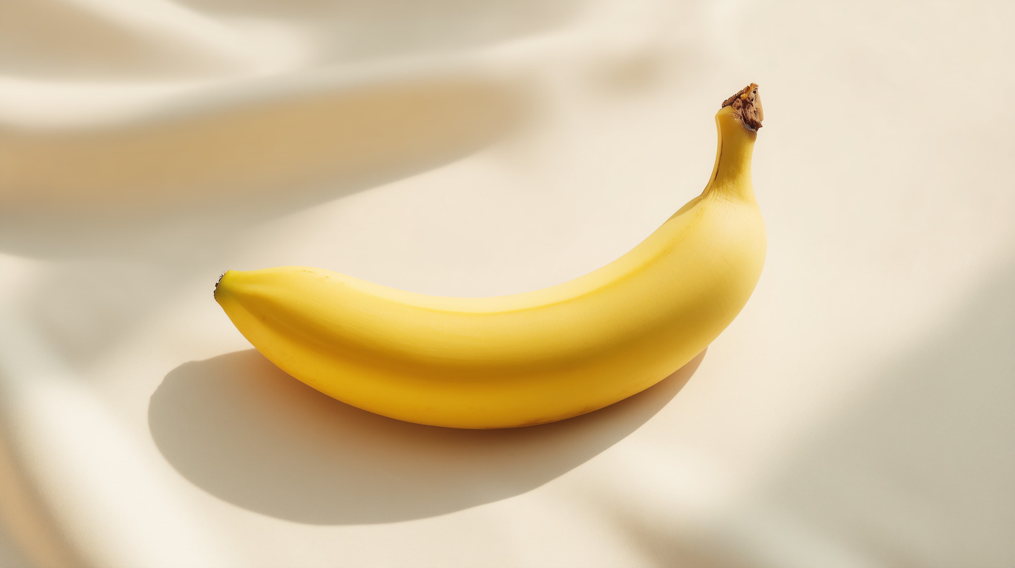 Bright Banana on Soft Golden Surface Wallpaper for Desktop - High Resolution banana Wallpaper for Mobile and Desktop