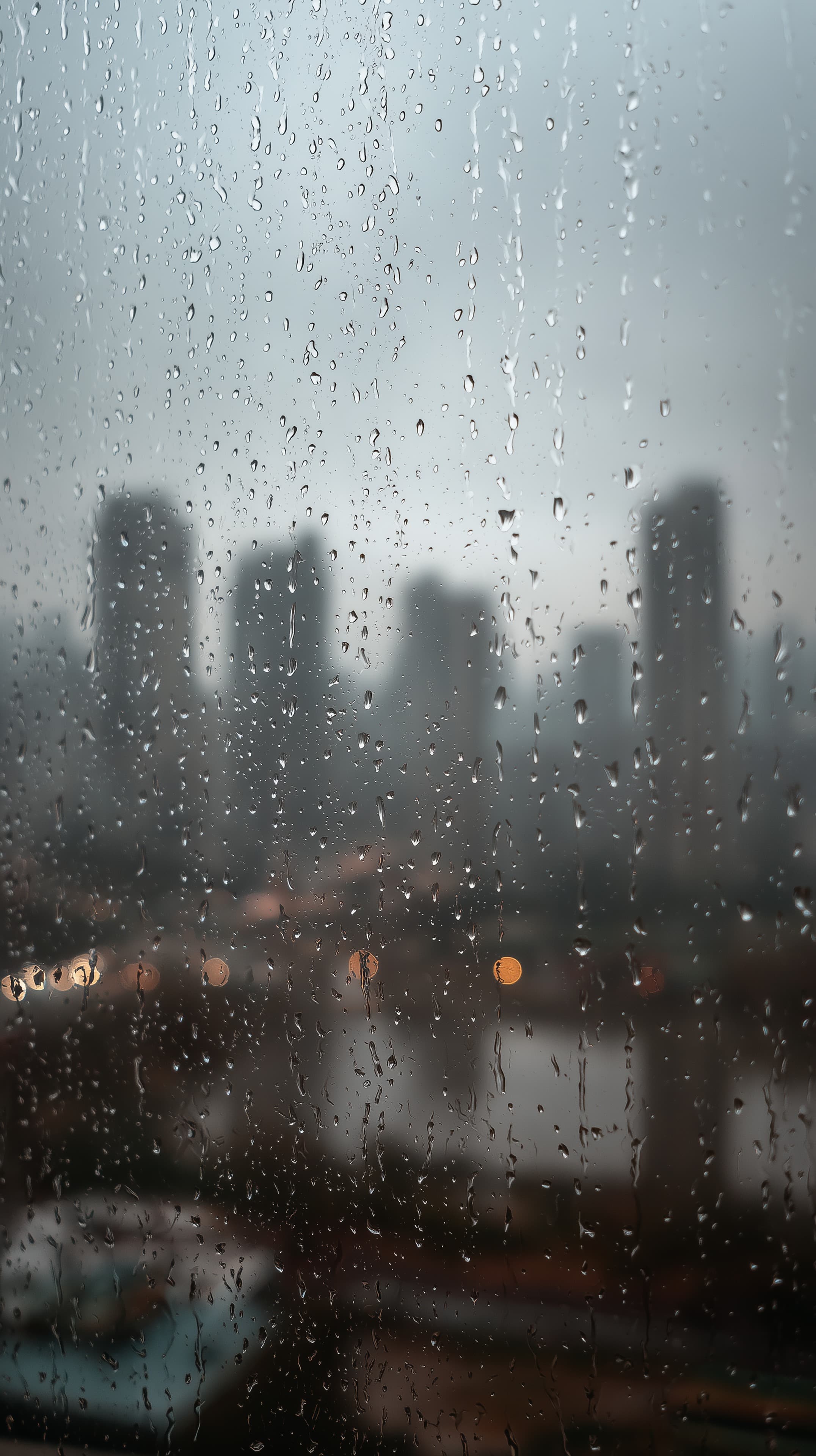 Moody Rainy Cityscape Wallpaper - Blurred Skyline Through Glass - High Resolution blurriness Wallpaper for Mobile and Desktop