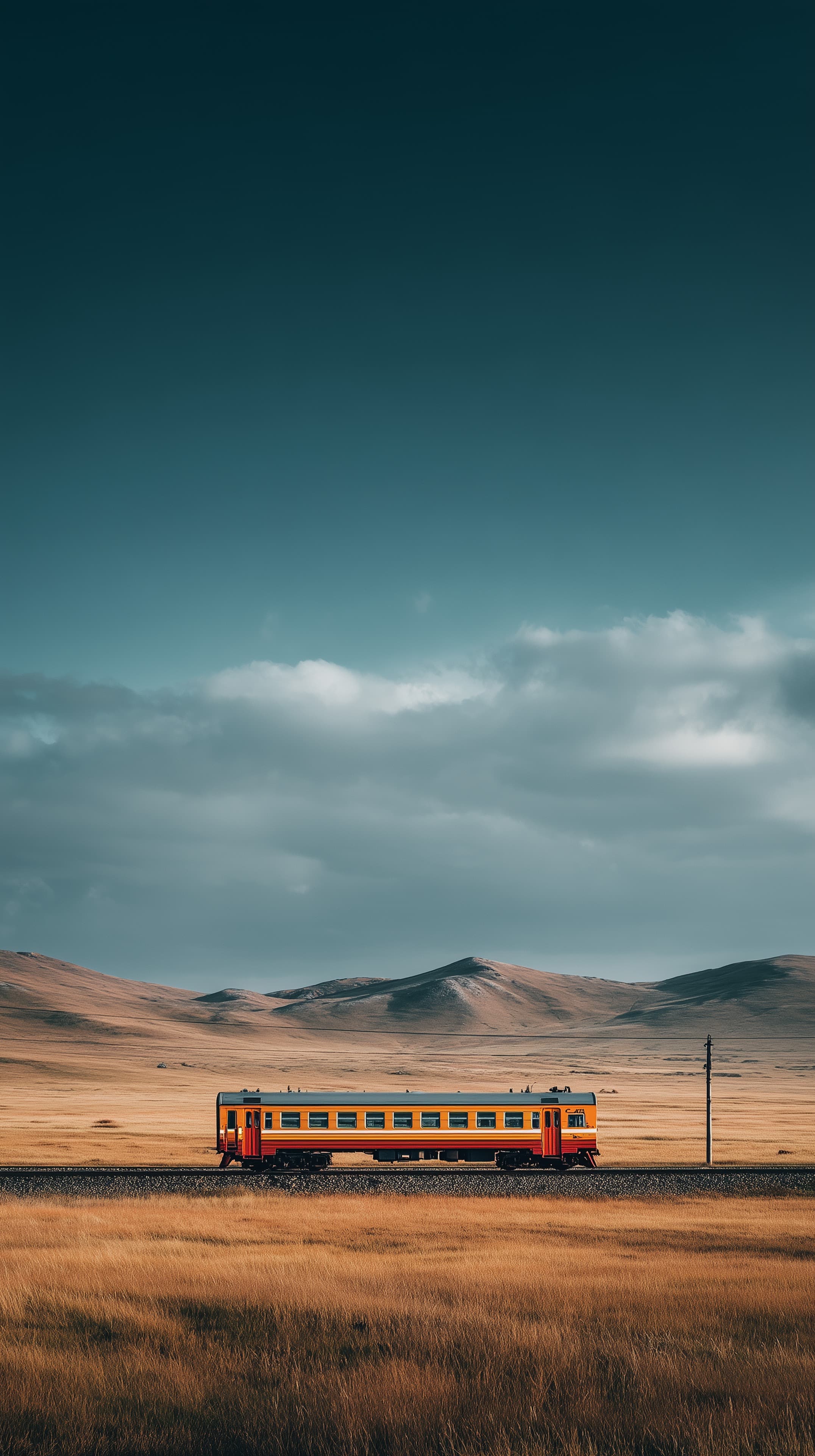 Vast Grassland with Orange Train — Moody Sky Wallpaper - High Resolution desert-landscape Wallpaper for Mobile and Desktop