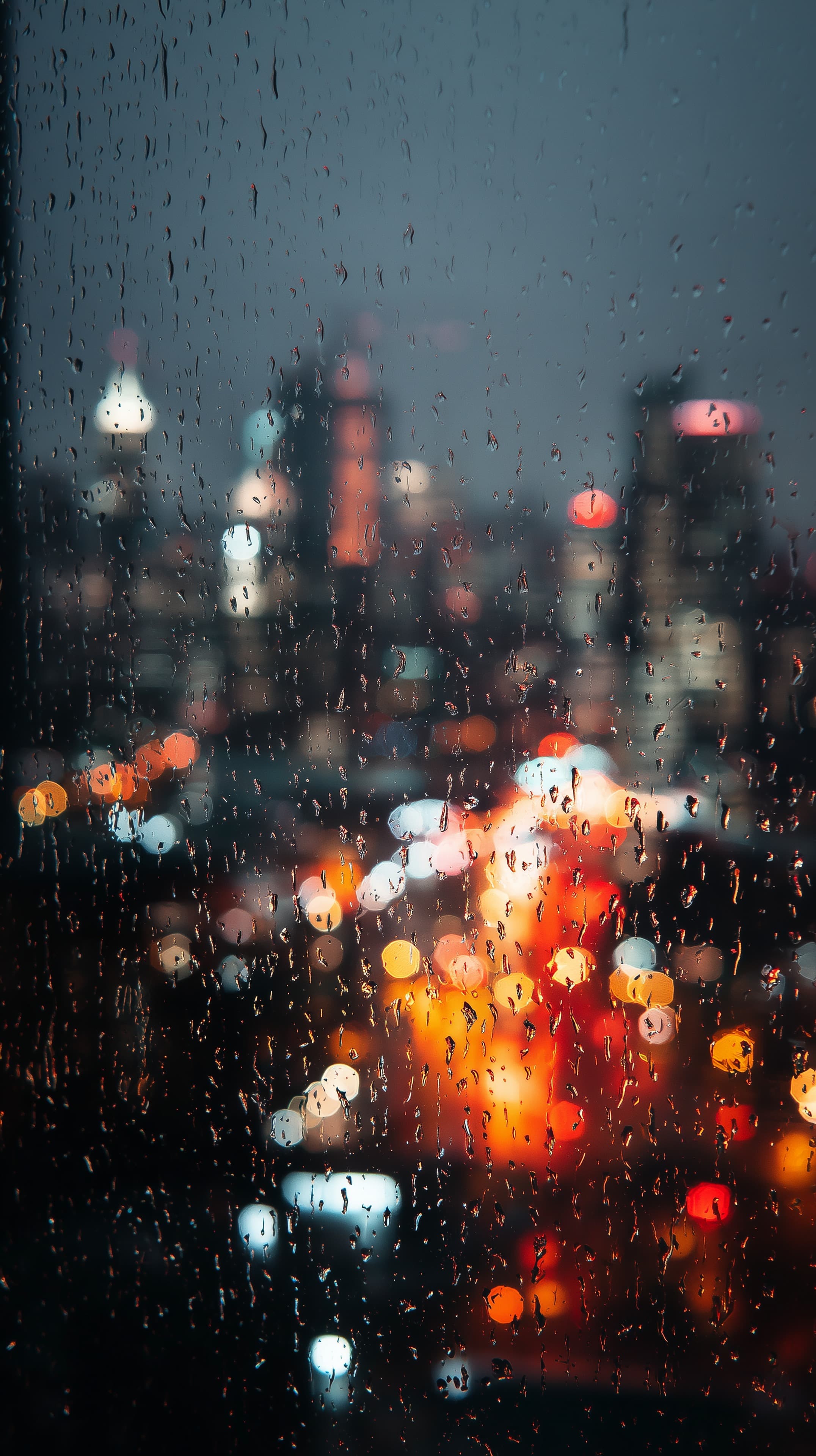 Rainy Night Cityscape with Soft Bokeh Lights - Urban Rain Wallpaper - High Resolution bokeh Wallpaper for Mobile and Desktop