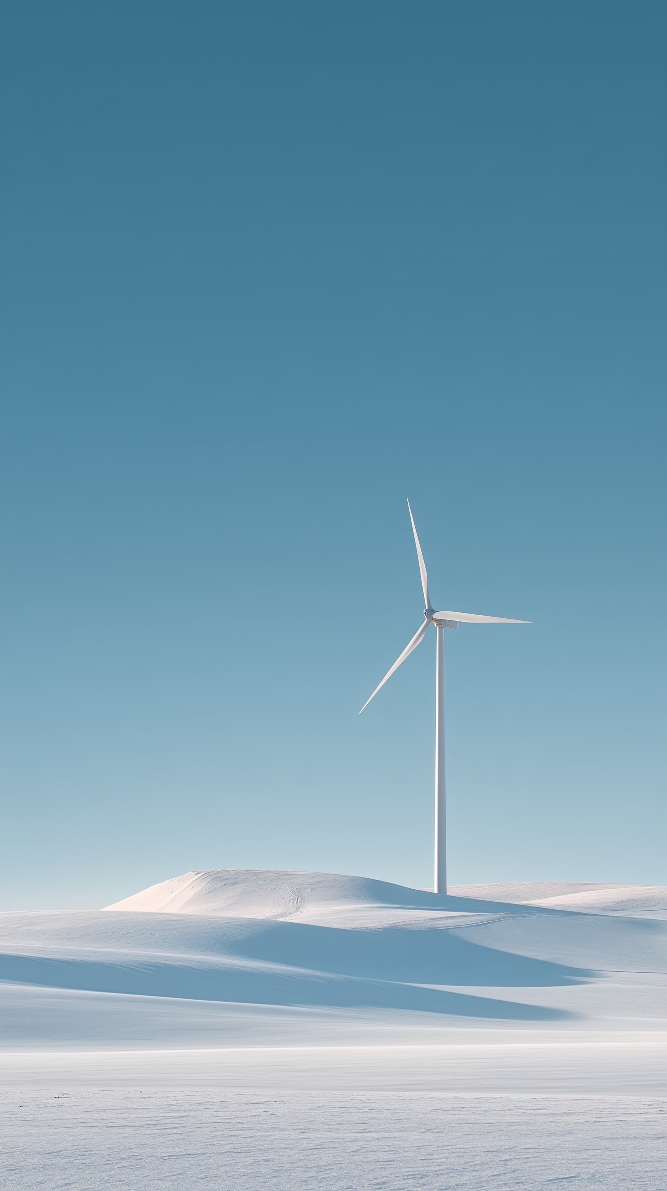 Minimalist Winter Wind Turbine in Snowy Dune Landscape - High Resolution blue-sky Wallpaper for Mobile and Desktop