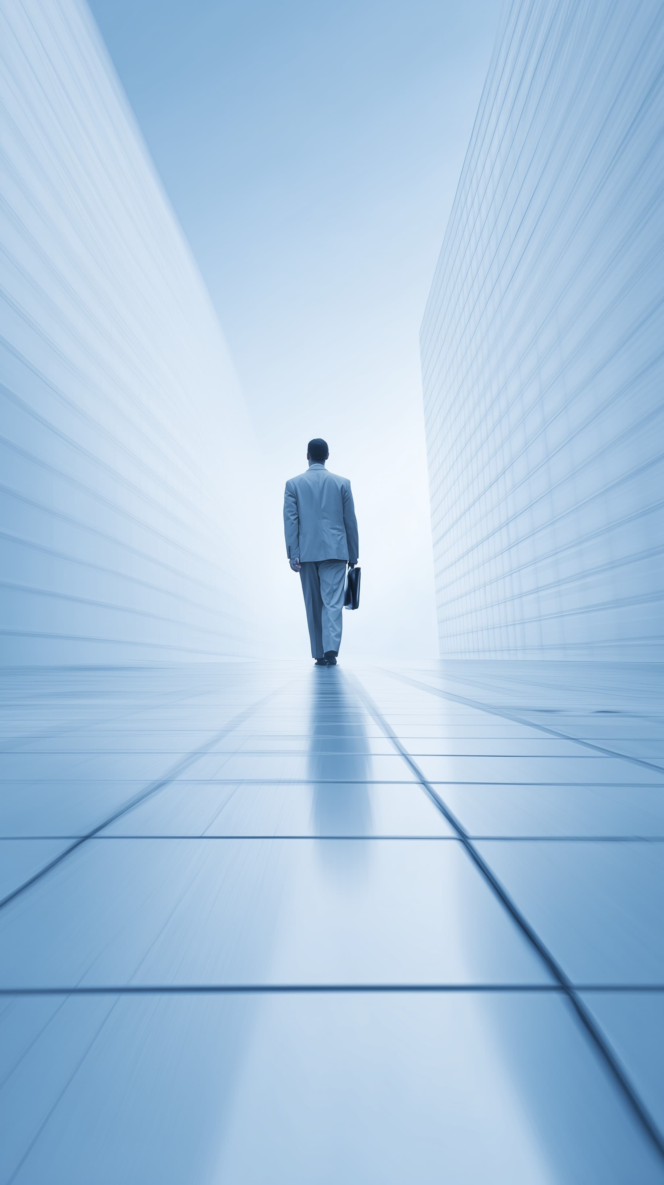 Futuristic Blue Corridor Wallpaper: Businessman Walking Toward Light - High Resolution blue-tones Wallpaper for Mobile and Desktop